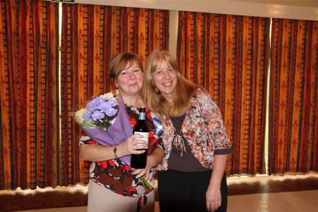 Presentation of flowers and wine to show judge