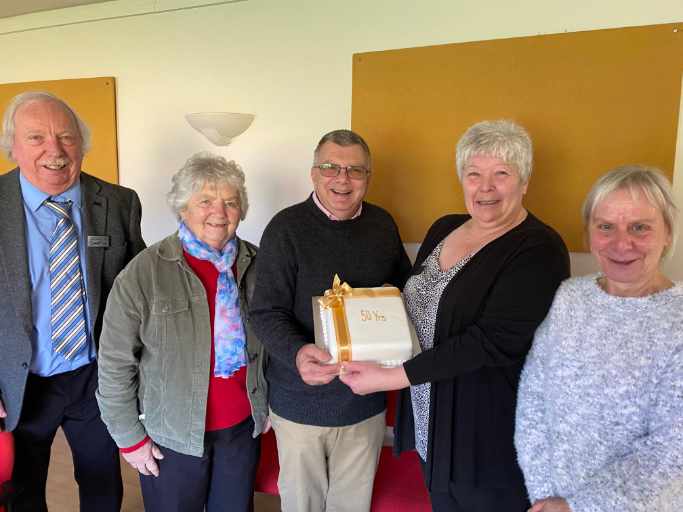 Celebrants with the cake